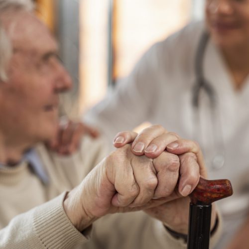casual-senior-man-home-with-doctor